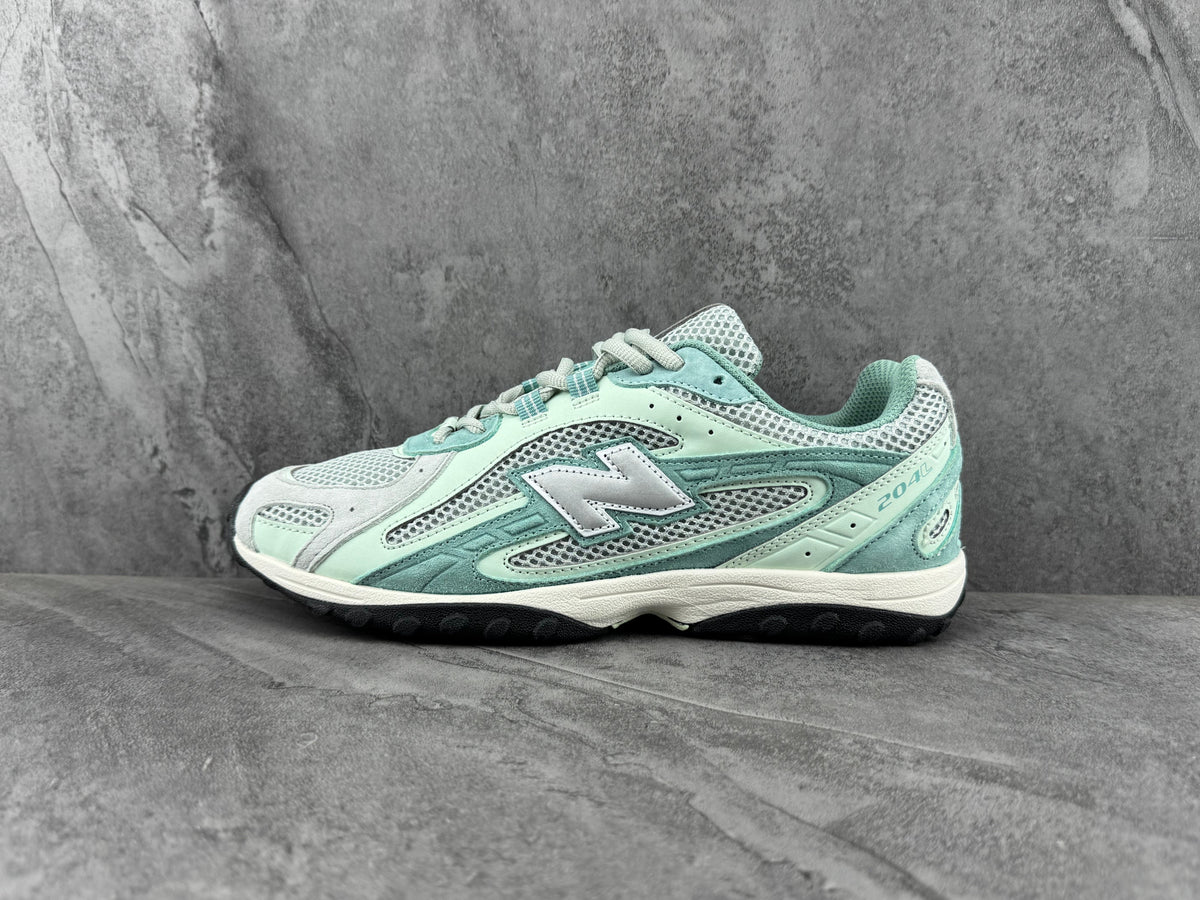 Mint Green and Grey New Balance 204L Sneakers - product image from the listing.