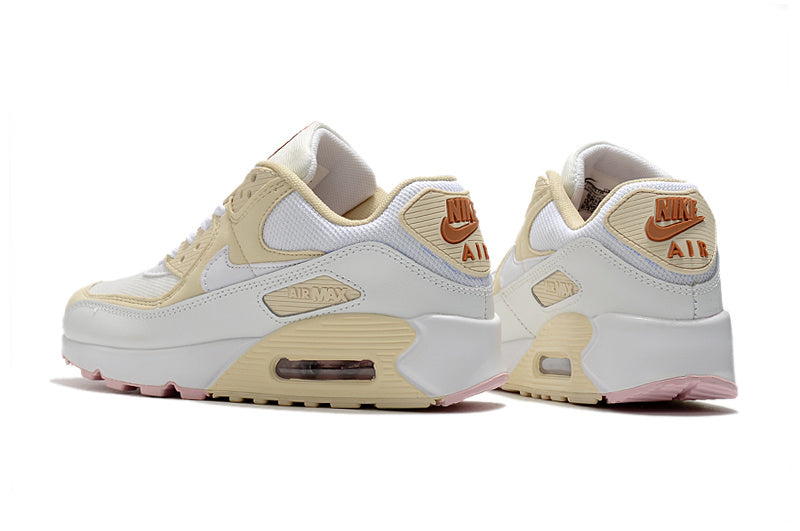 Women's Nike Air Max 90 Sneakers in Cream and Pink - product image from the listing.