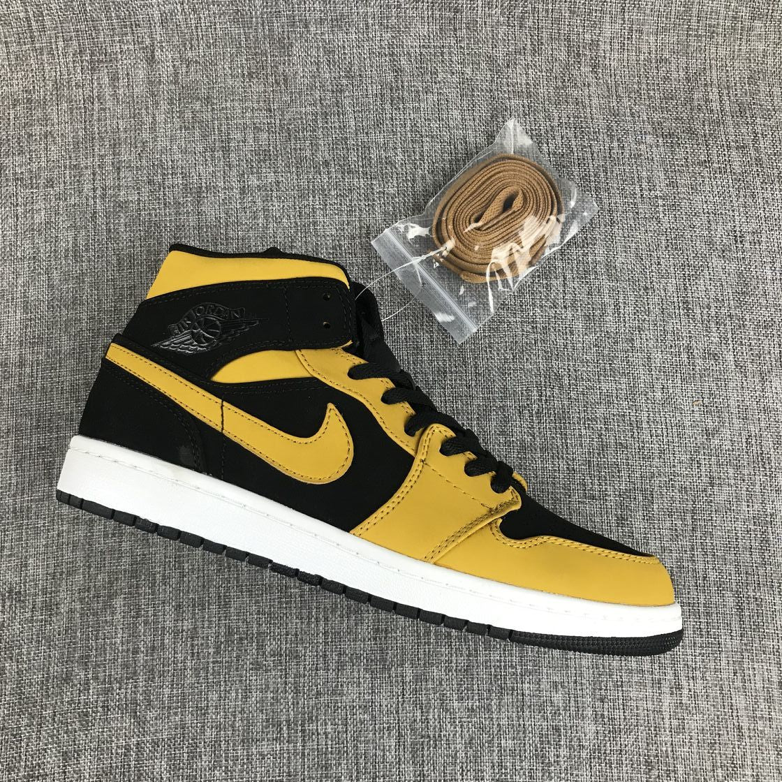 Air Jordan 1 Mid Sneakers in Black and Yellow - product image from the listing.