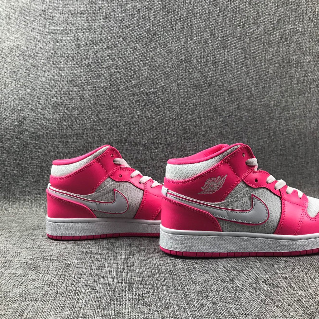 Air Jordan 1 Mid Sneakers in White Pink 555112-611 - product image from the listing.