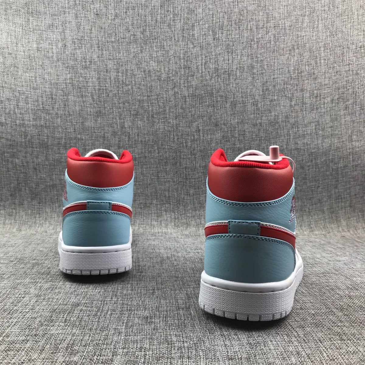 Air Jordan 1 Mid Sneakers in Ice Blue White and Red 555112-104 - product image from the listing.