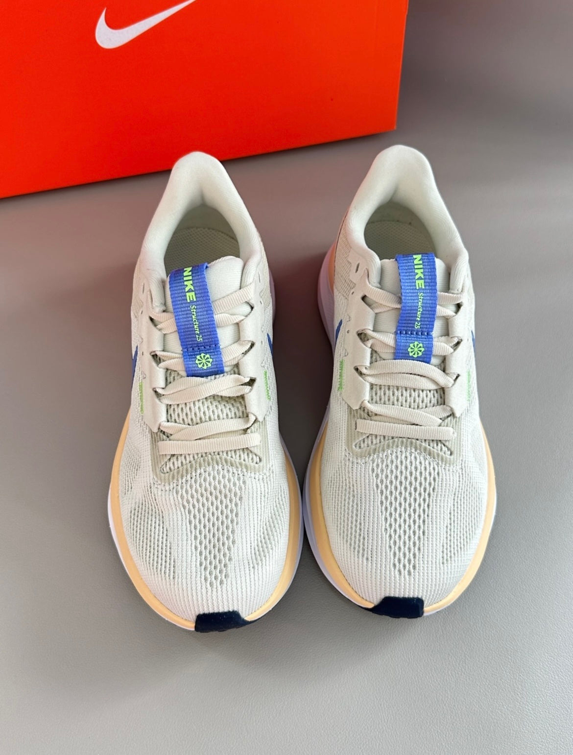 Nike Structure 25 Road Running Shoes DJ7884-004 in Beige - product image from the listing.