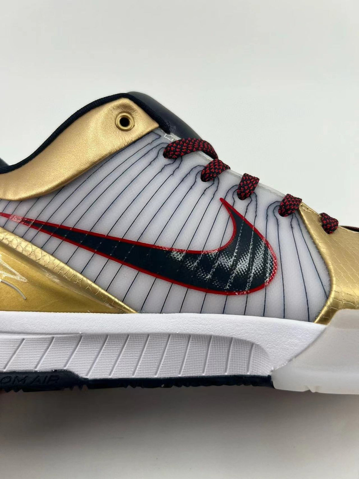 Nike Kobe 4 Protro Sneakers in Gold White 344335-141 - product image from the listing.