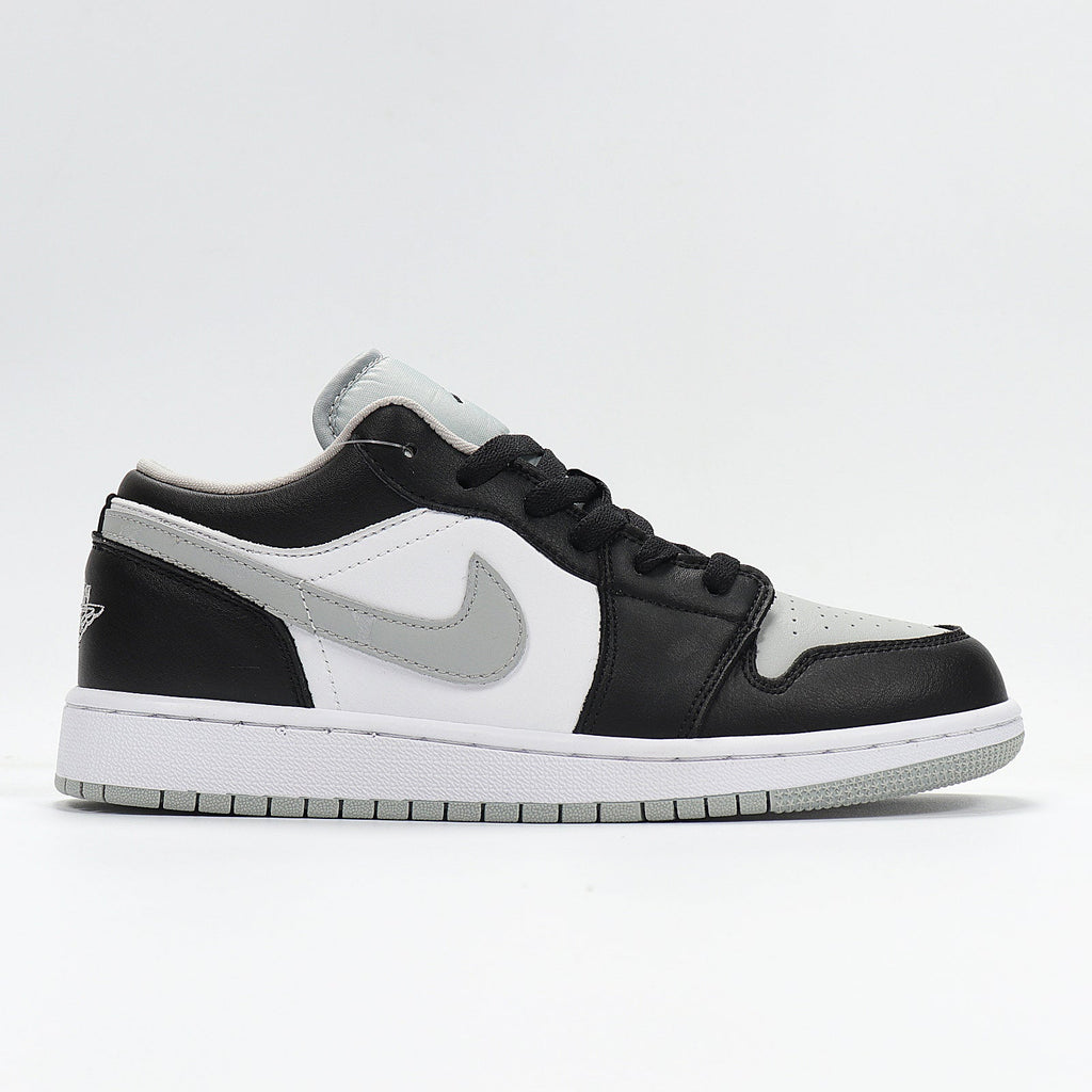 Jordan 1 Low Sneakers in Cool Grey 553560-039 - product image from the listing.