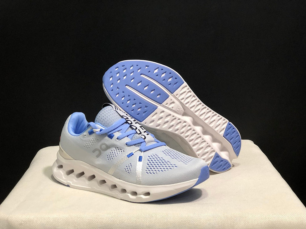 On Cloudsurfer Running Shoes, Heather in White and Blue - product image from the listing.