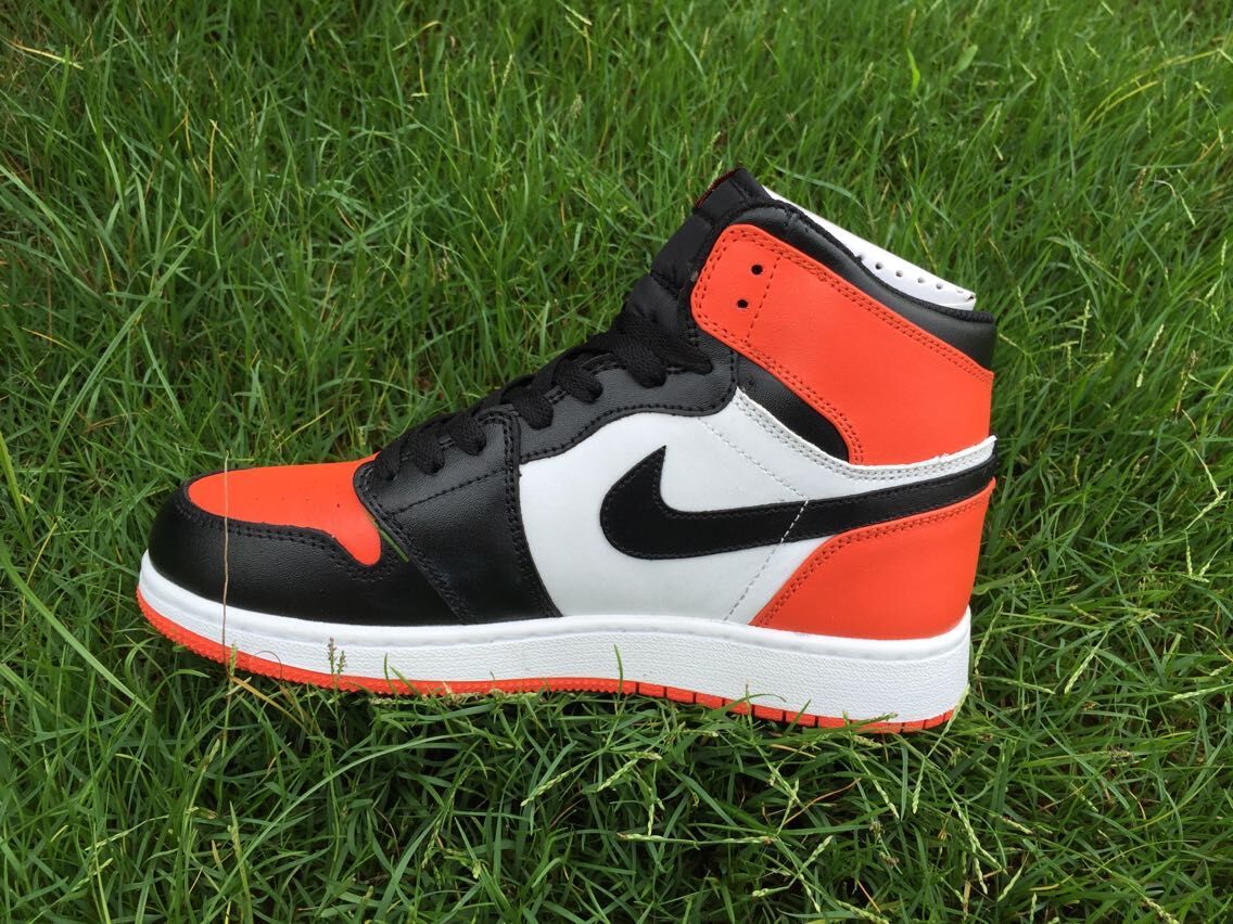 Women's Jordan 1 High Black Orange White Sneakers - product image from the listing.