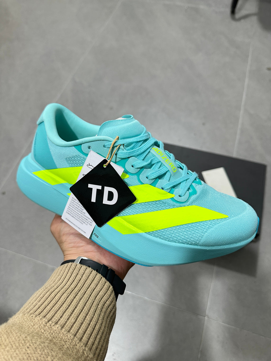 Adidas Lightstrike Pro Running Shoes, in Turquoise and Volt - product image from the listing.