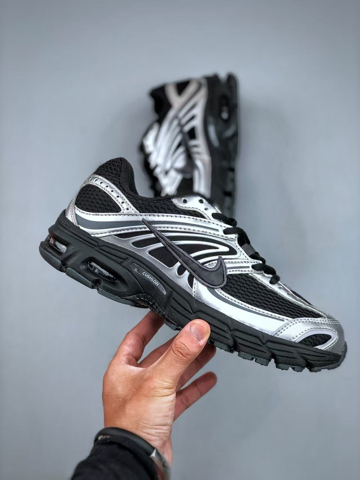 Nike Air Max Moto 2K Running Shoes in Black and White - product image from the listing.