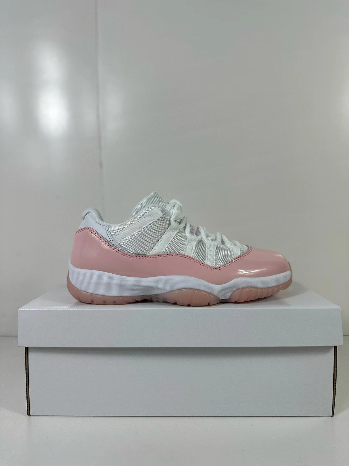 Air Jordan 11 Low Women's Pink Sneakers AH7860-160 - product image from the listing.