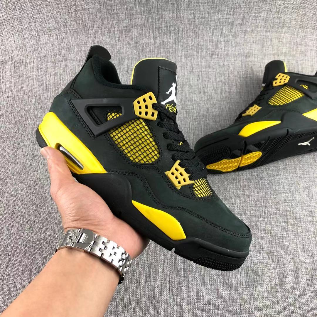 Air Jordan 4 Thunder Black Yellow Sneakers - product image from the listing.