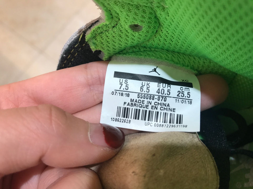 Jordan 1 Retro High OG High-Top Sneakers in Grey Green - product image from the listing.