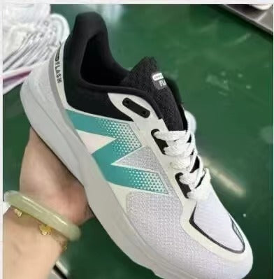 White and Teal New Balance MFLSHBW Running Shoe - product image from the listing.