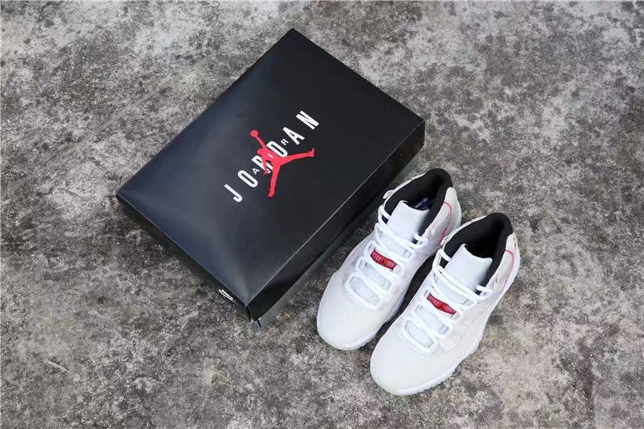 Air Jordan 11 Platinum Tint White High-Top Sneakers - product image from the listing.