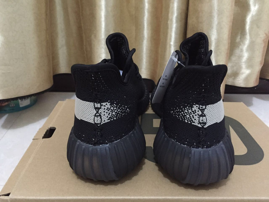 Adidas Yeezy Boost 350 V2 Sneakers in Black White - product image from the listing.