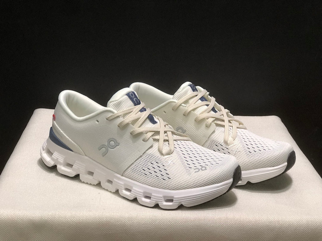 On Cloud X 4 Sneakers in Ivory and Blue - product image from the listing.