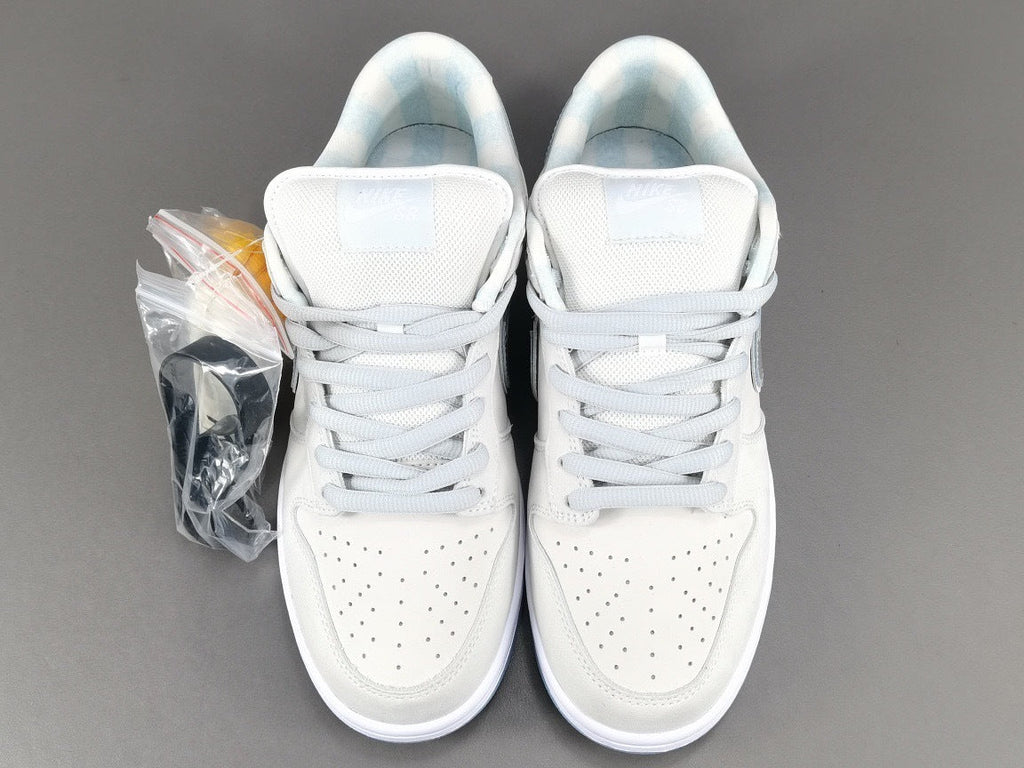 Nike Dunk Low SB Purple Lobster Sneakers in White FD8776-100 - product image from the listing.