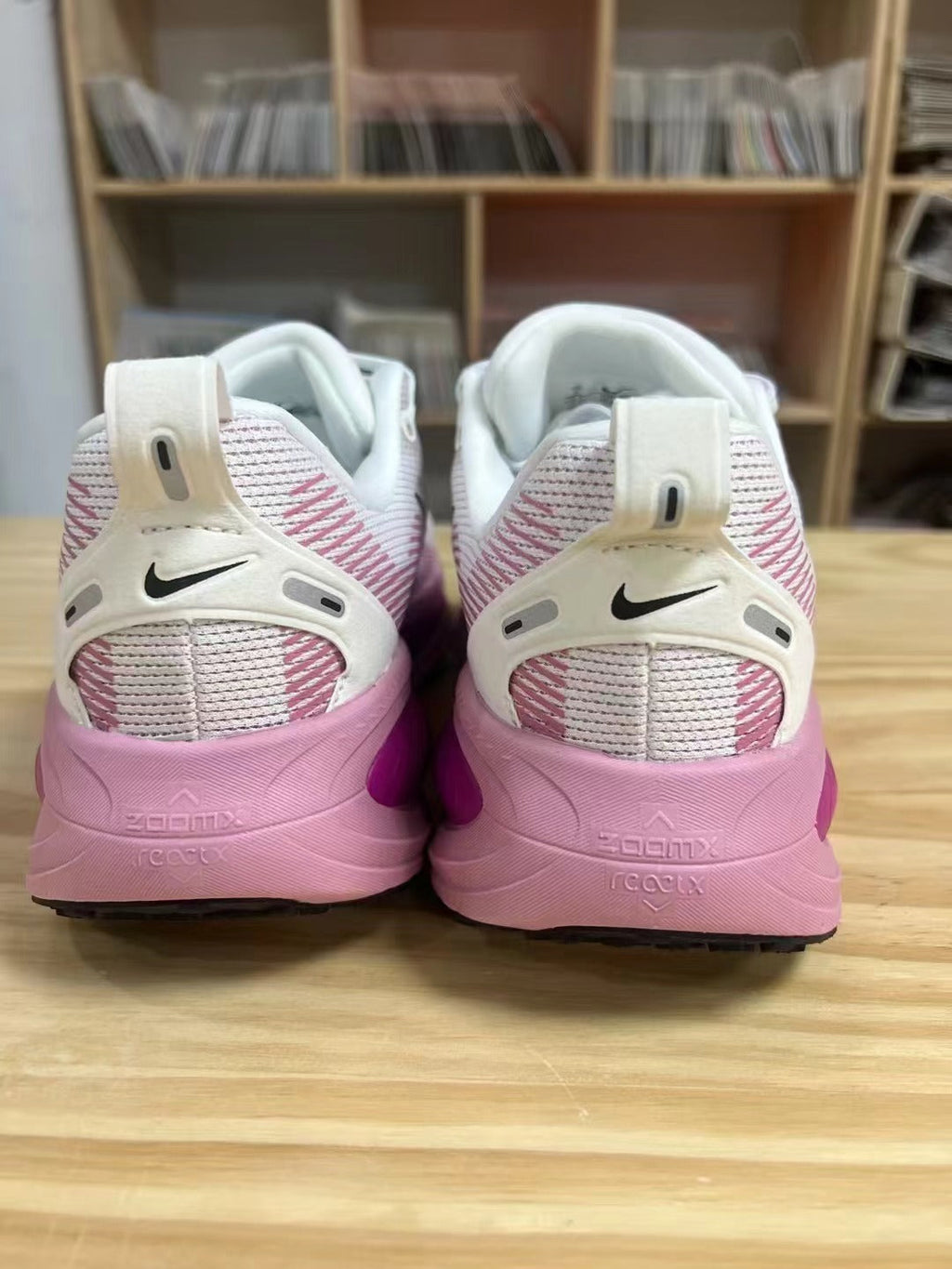 Nike Vomero 18 Running Shoes in White Pink - product image from the listing.