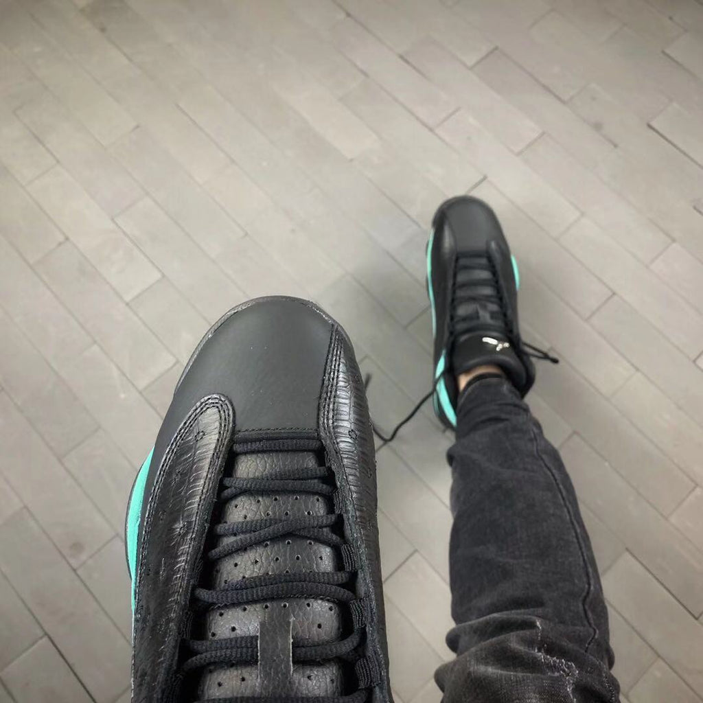 Air Jordan 13 Island Green Sneakers in Black Turquoise - product image from the listing.