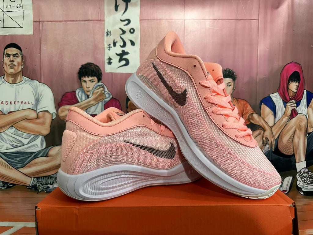 Pink and White Nike Basketball Shoes - product image from the listing.