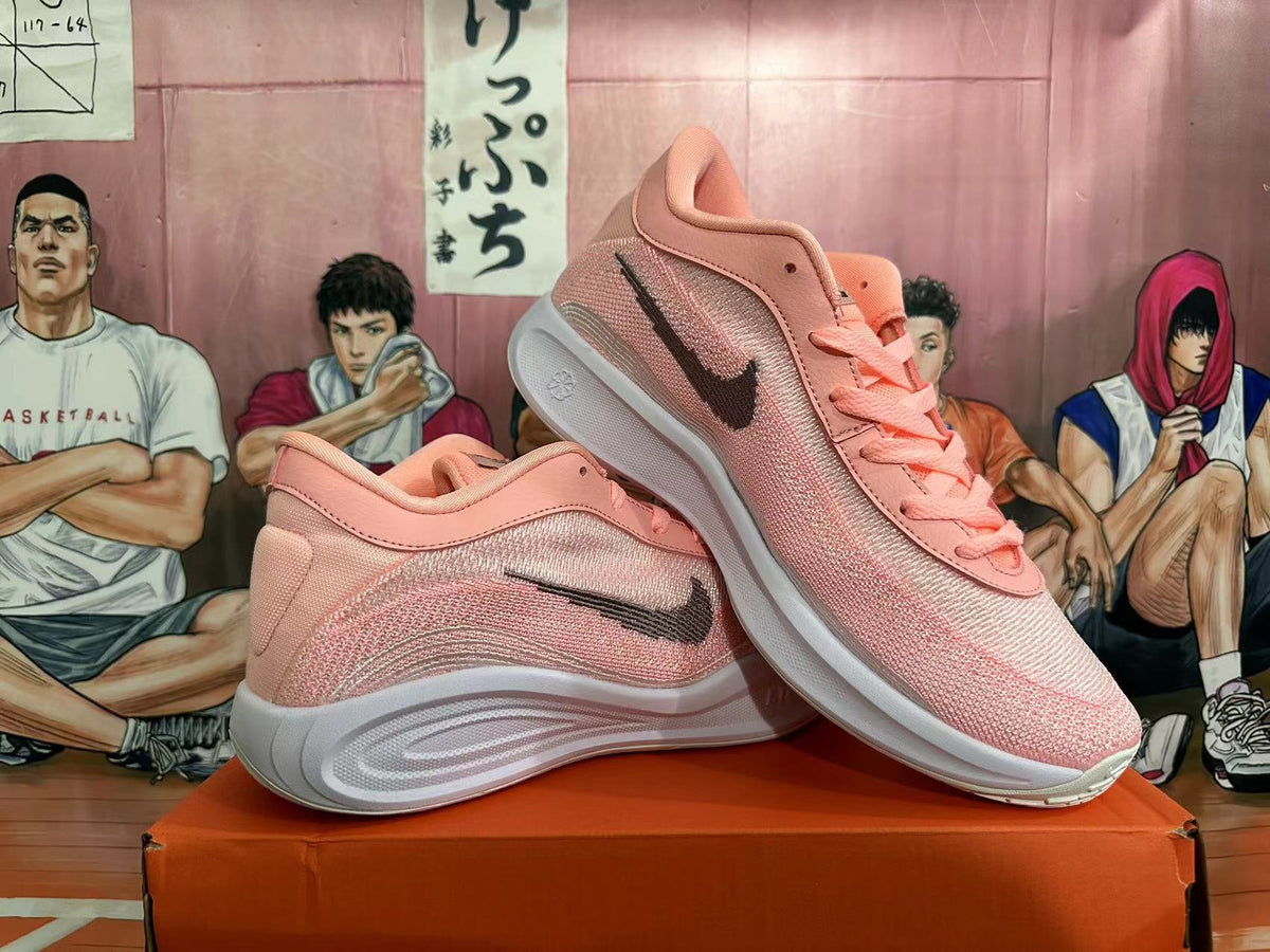 Pink and White Nike Basketball Shoes - product image from the listing.