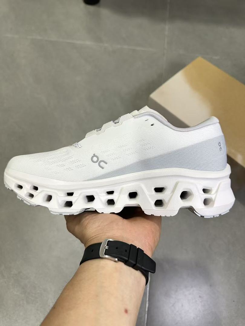 On Running Running Sneakers in White and Gray - product image from the listing.