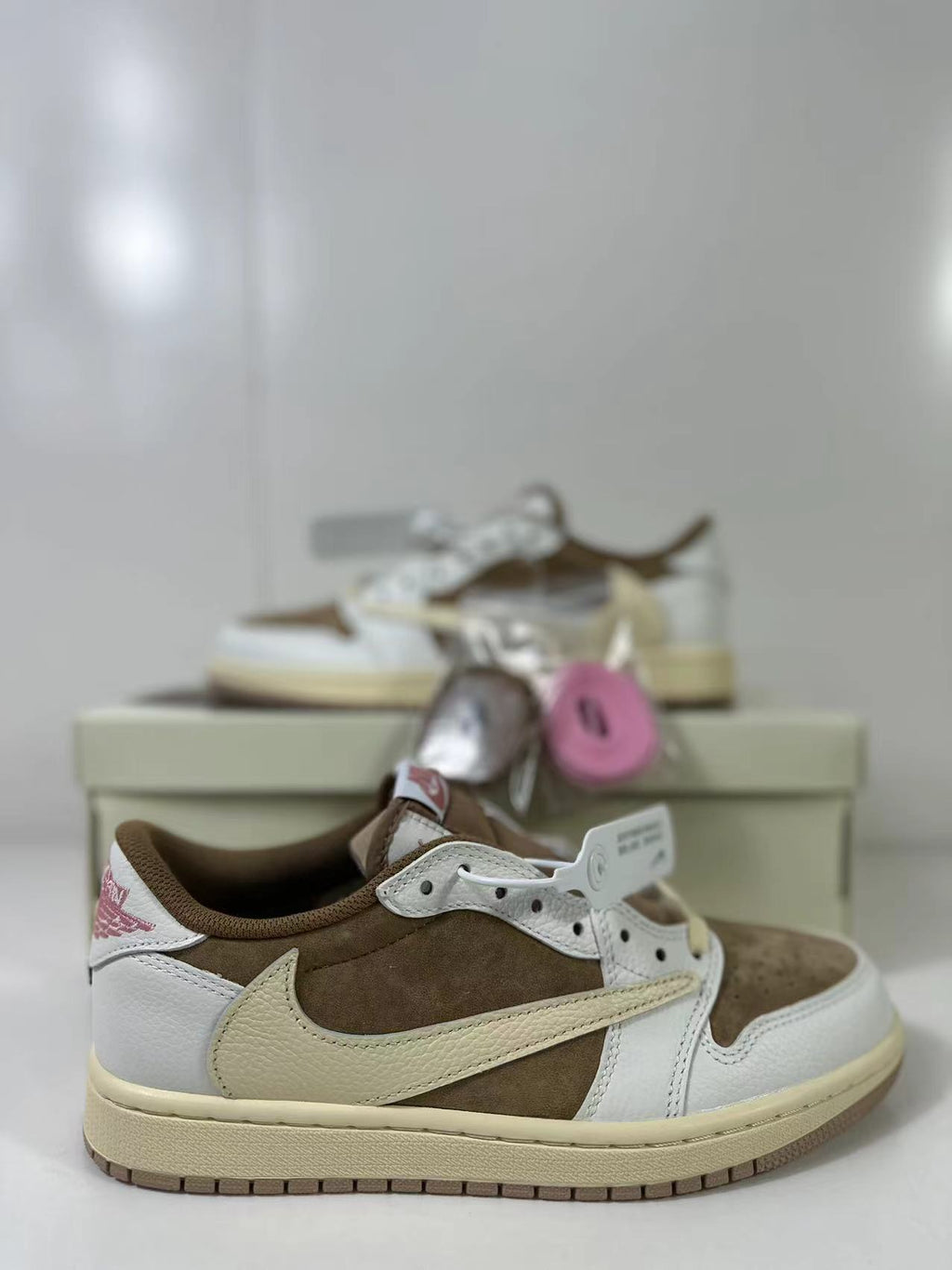 Travis Scott x Air Jordan 1 Low Reverse in Mocha Pink DM7866-106 - product image from the listing.