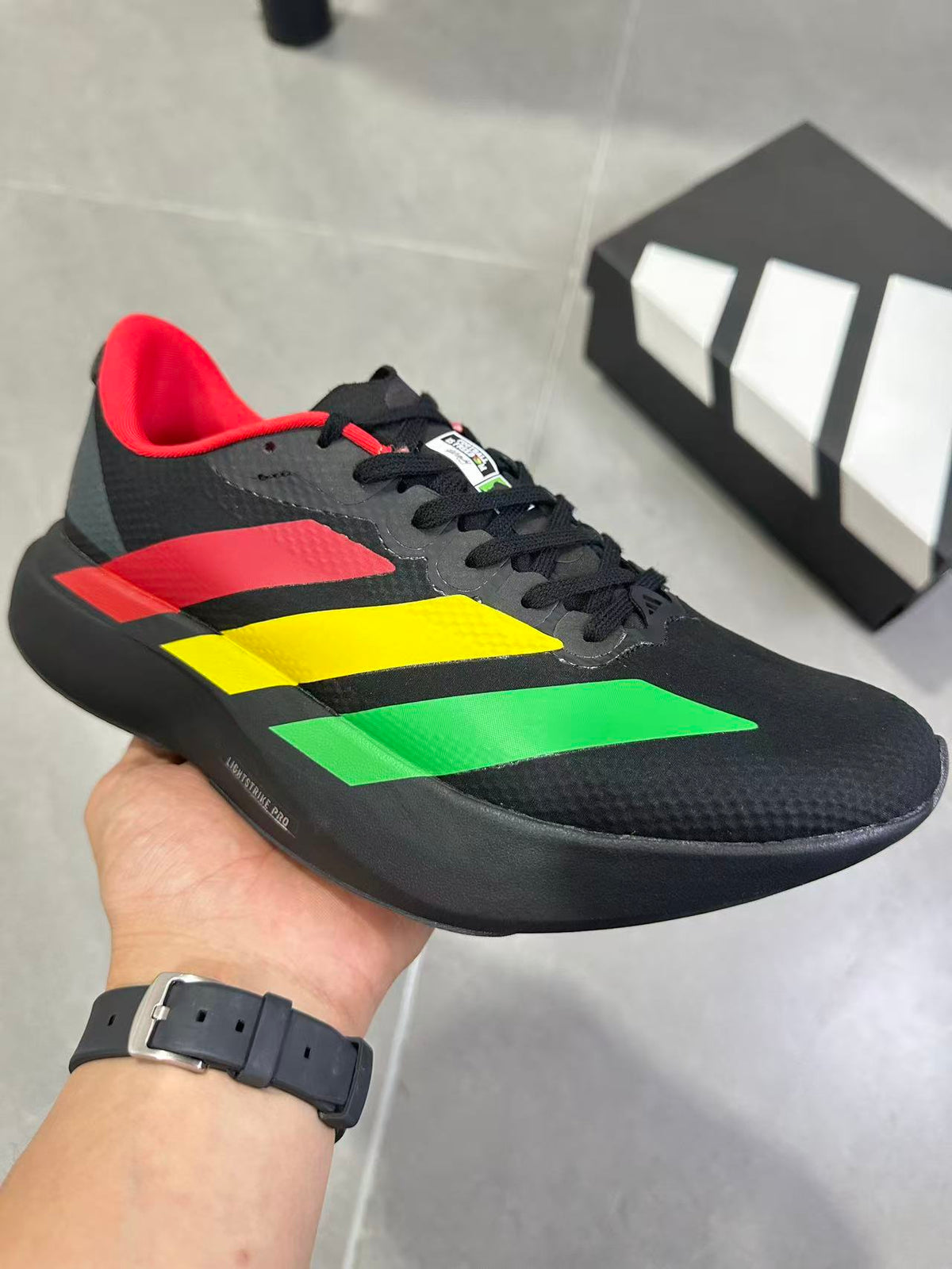 Adidas Lightstrike Pro Running Shoes, in Black Green Yellow Red KJ6160 - product image from the listing.