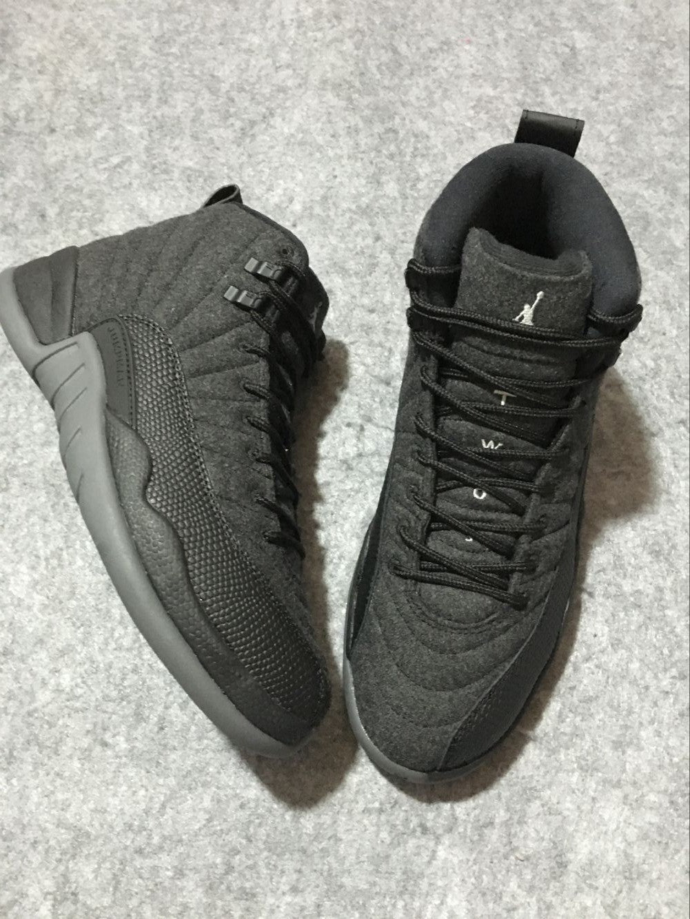 Black and Grey Air Jordan 12 High-Top Sneakers - product image from the listing.
