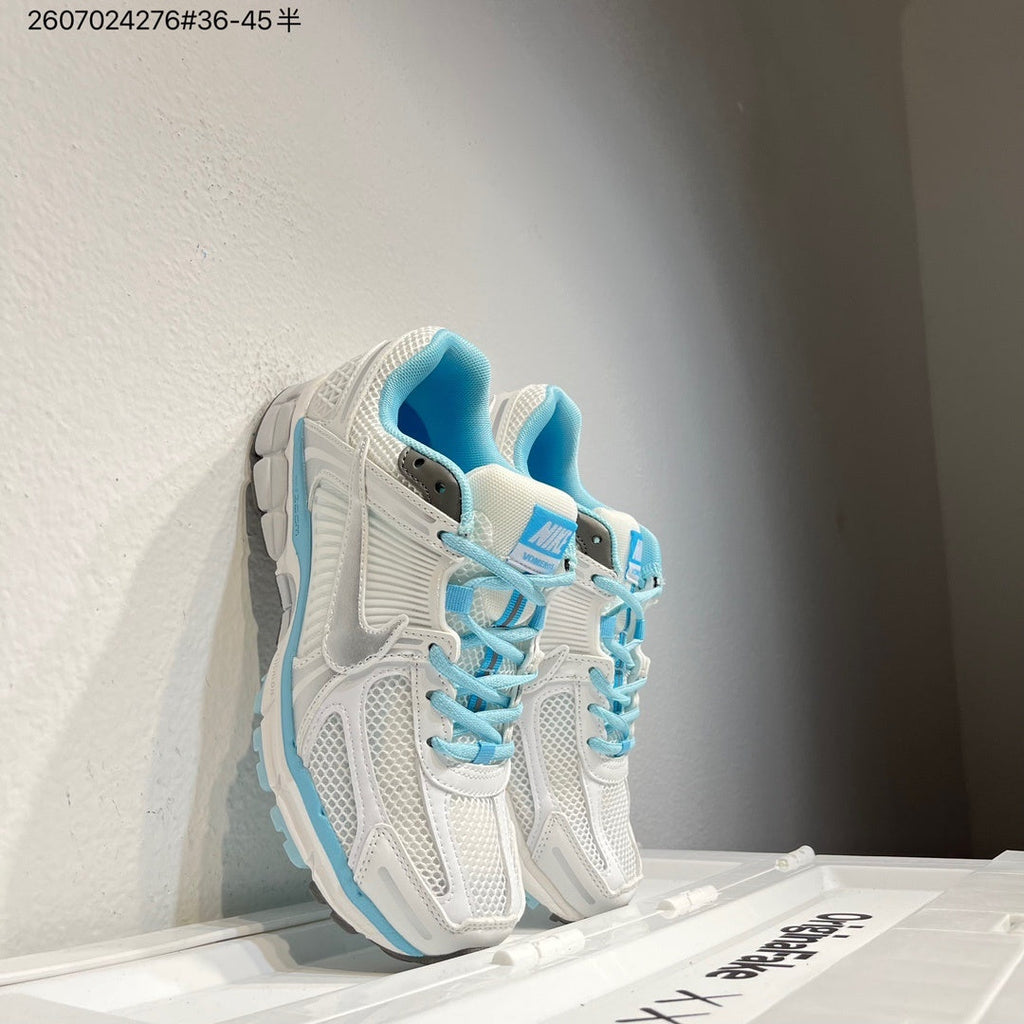 Nike Air Zoom Vomero 5 Sneakers in White and Blue - product image from the listing.