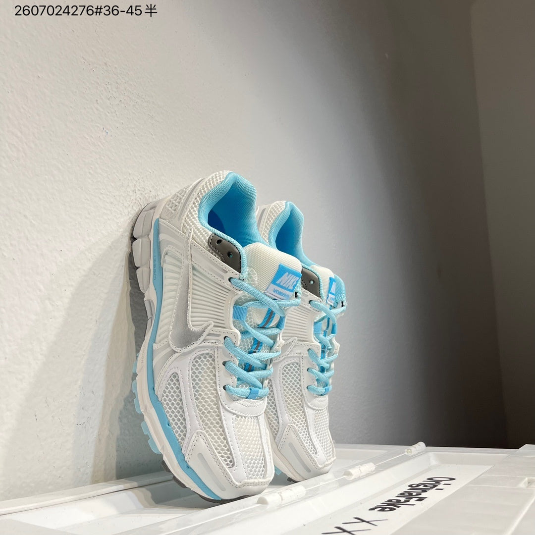 Nike Air Zoom Vomero 5 Sneakers in White and Blue - product image from the listing.