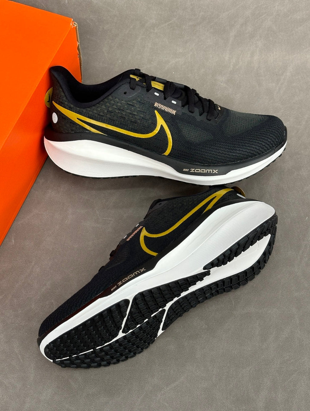 Nike Air Zoom Vomero 17 Running Shoes in Black Gold FB1309-006 - product image from the listing.