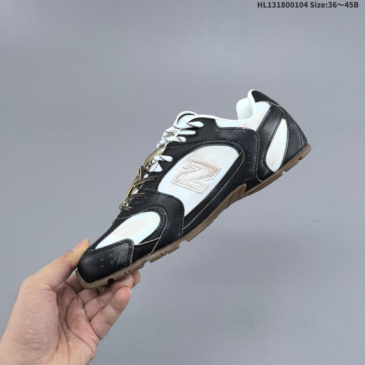 Black and White New Balance 530 SL Low-Top Sneakers - product image from the listing.