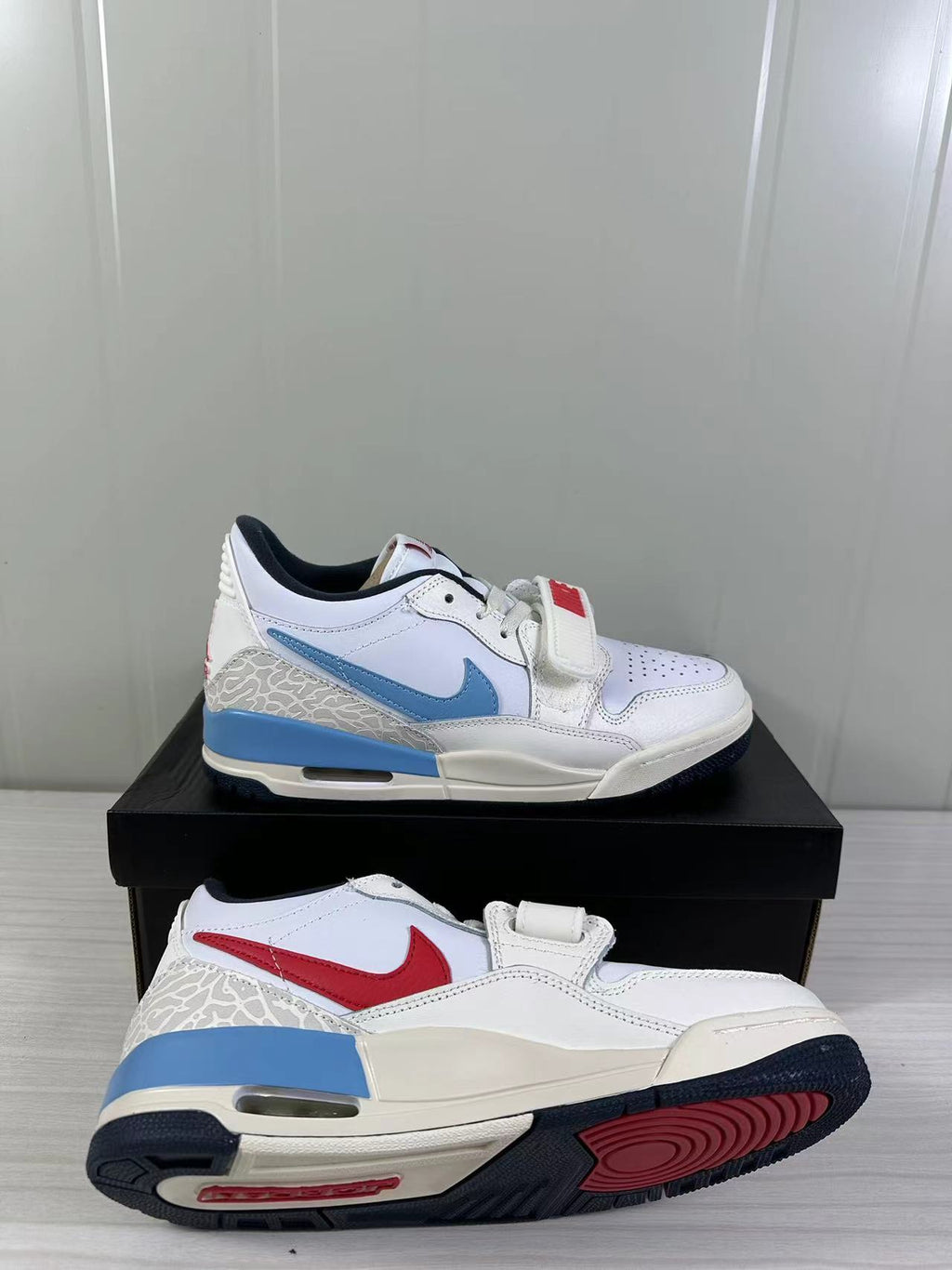 Jordan Legacy 312 Low in White Blue Red HM3709-141 - product image from the listing.