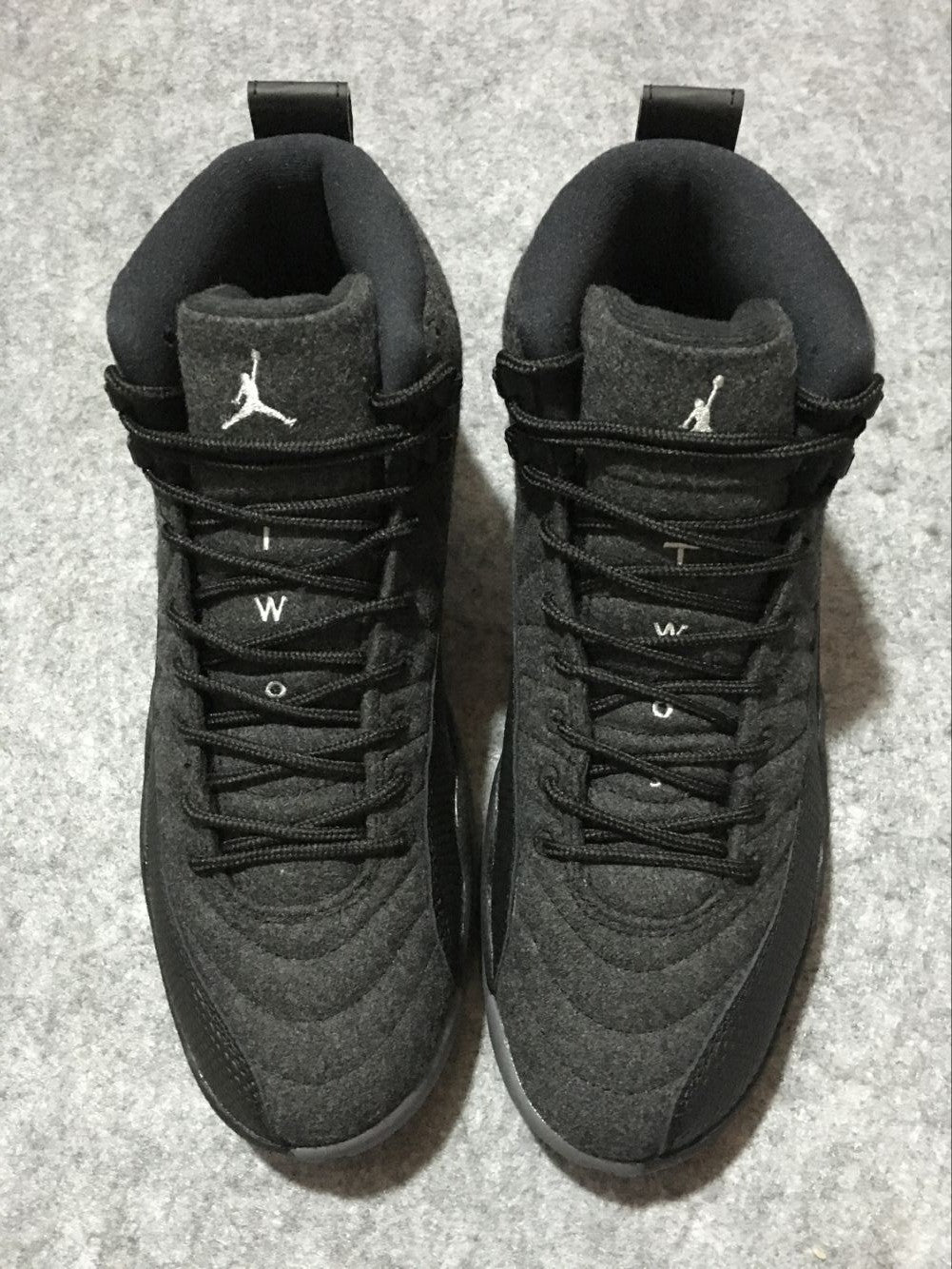 Black and Grey Air Jordan 12 High-Top Sneakers - product image from the listing.