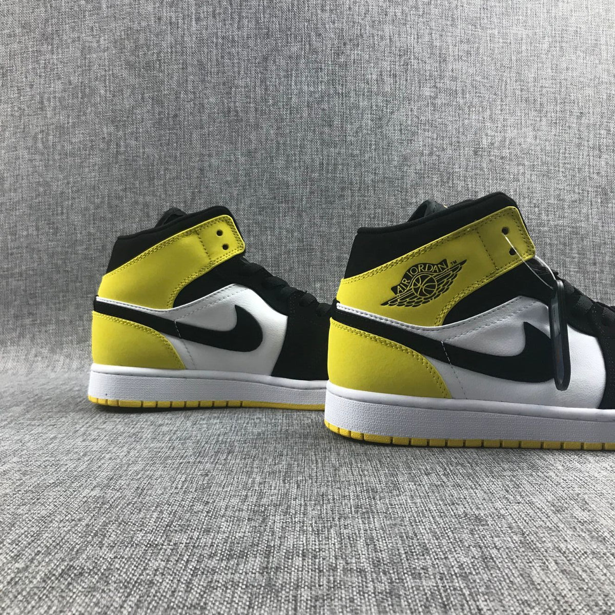 Black Yellow Toe Sneakers - Air Jordan 1 Mid SE 852542-071 - product image from the listing.