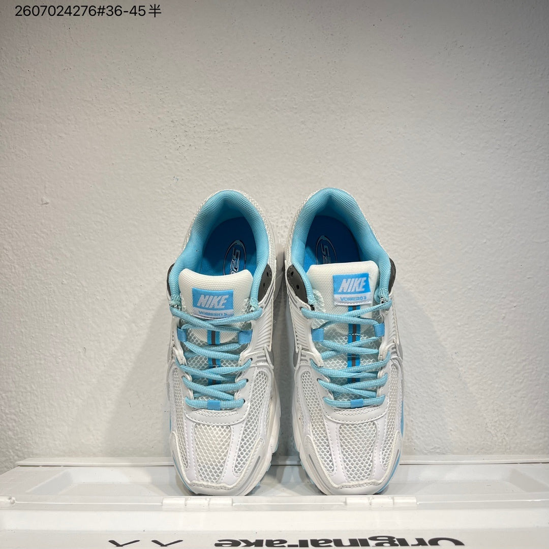 Nike Air Zoom Vomero 5 Sneakers in White and Blue - product image from the listing.