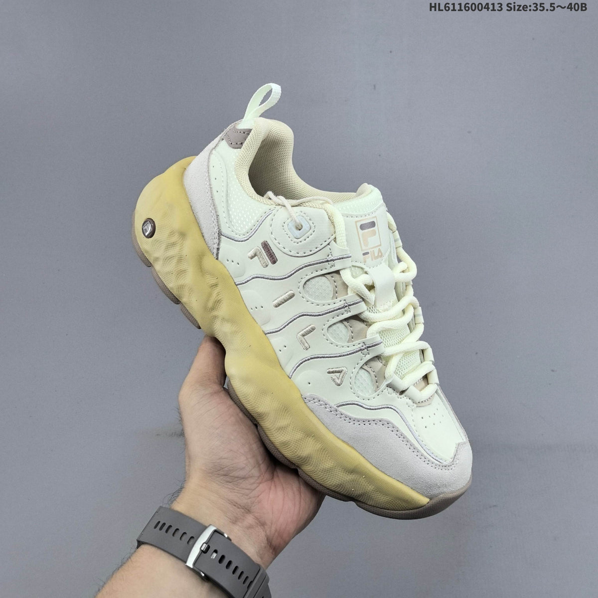 Cream and Charcoal FILA Chunky Sole Sneakers - product image from the listing.