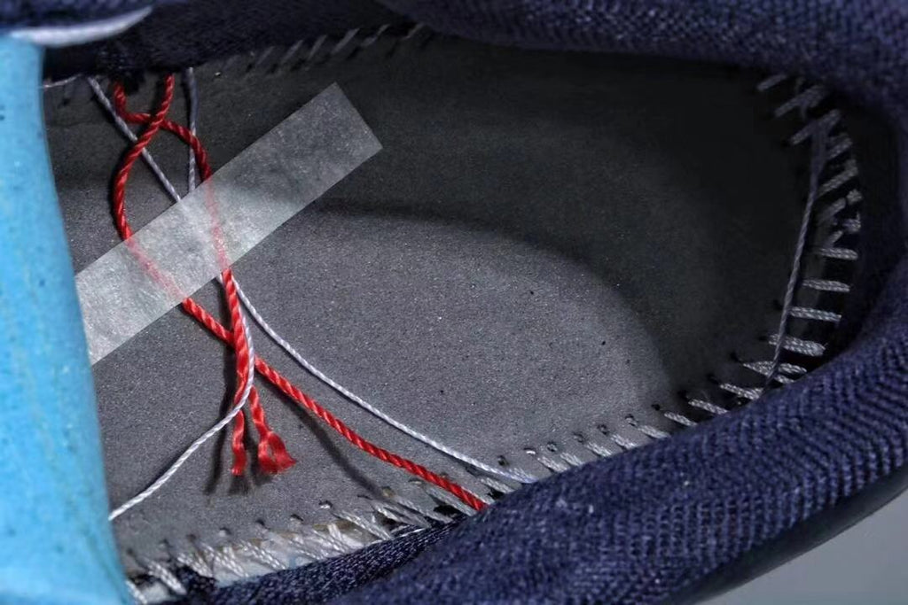 Jordan 1 Low Sneakers in Midnight Navy White Red - product image from the listing.