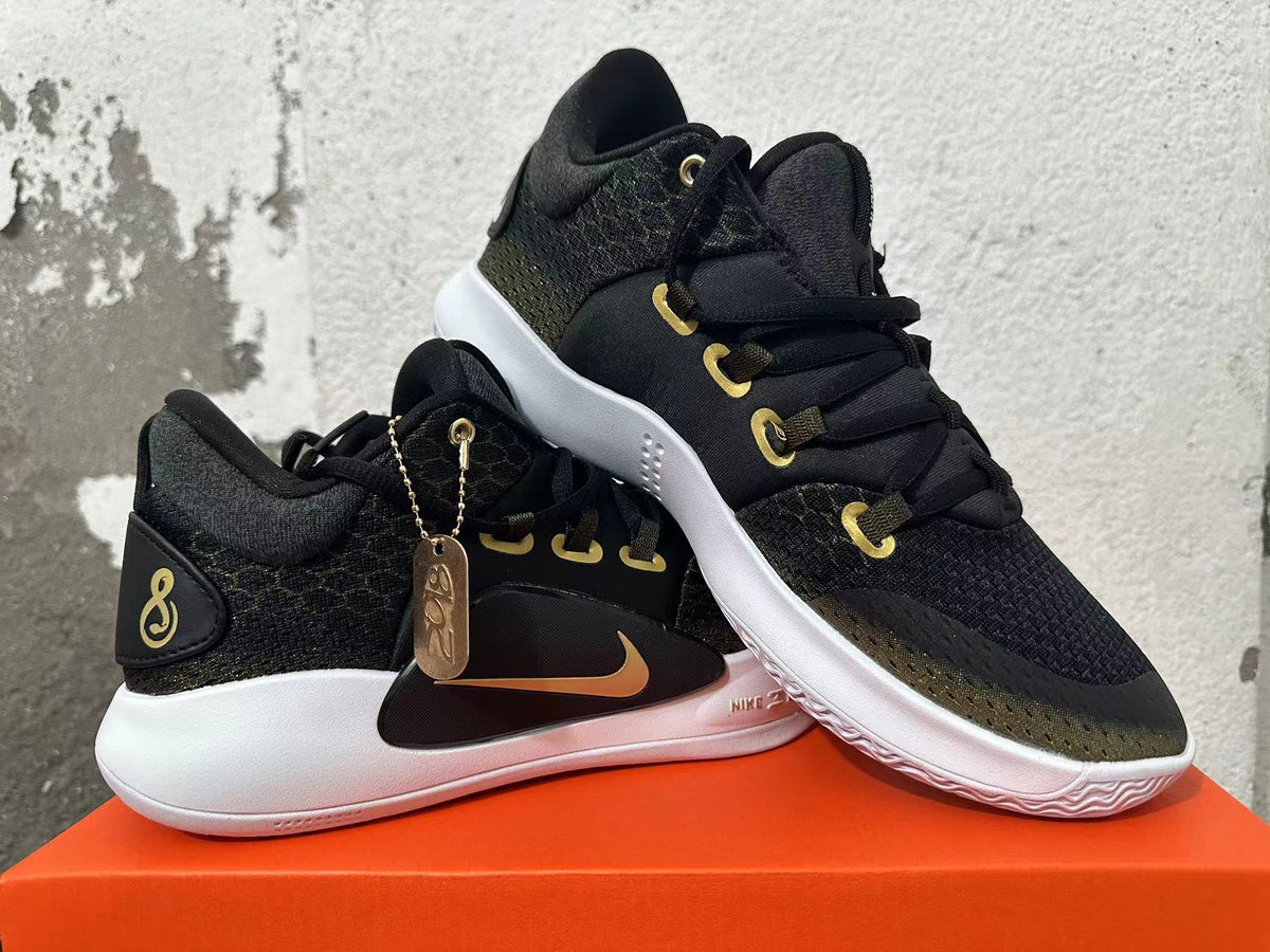 Nike Zoom Basketball Shoes in Black and Gold - product image from the listing.