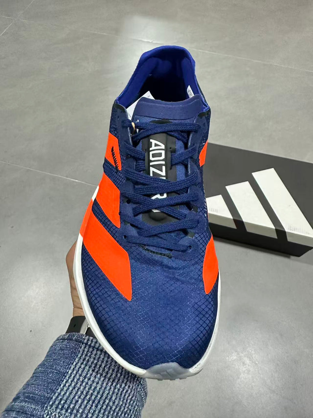 Nike Adizero Lightstrike Pro Running Shoes, in Navy and Orange - product image from the listing.