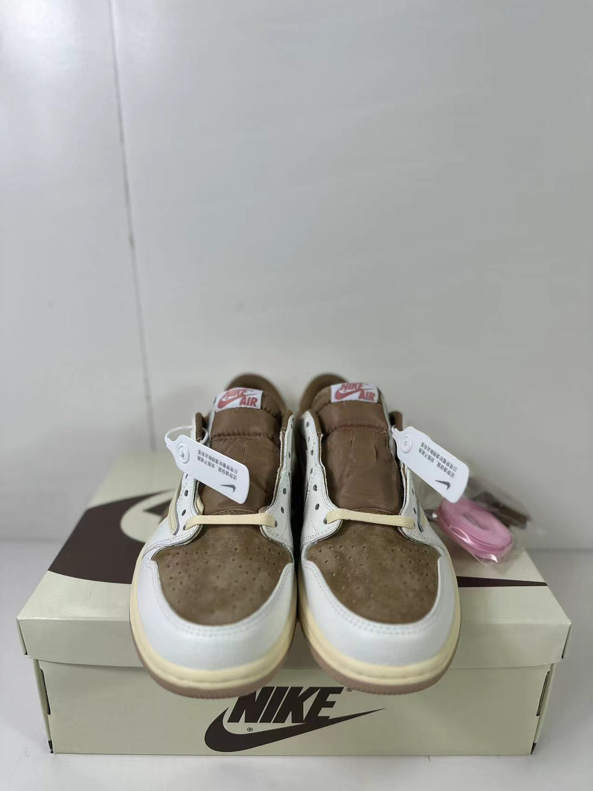 Travis Scott x Air Jordan 1 Low Reverse in Mocha Pink DM7866-106 - product image from the listing.