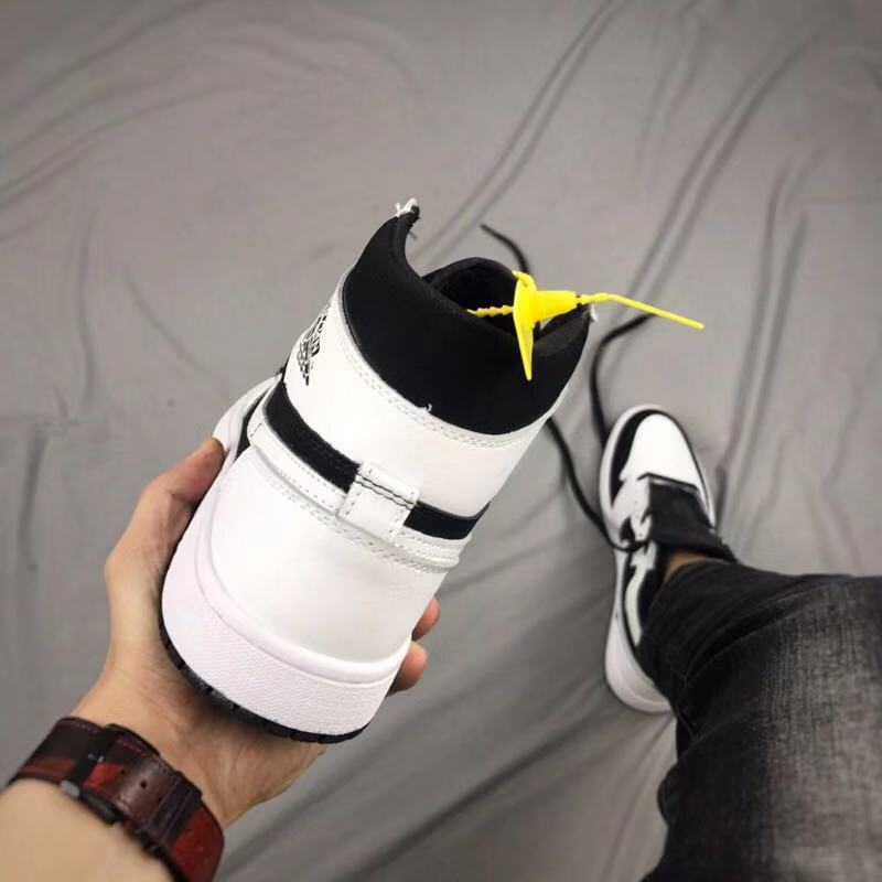Air Jordan 1 High Sneakers in Black and White - product image from the listing.