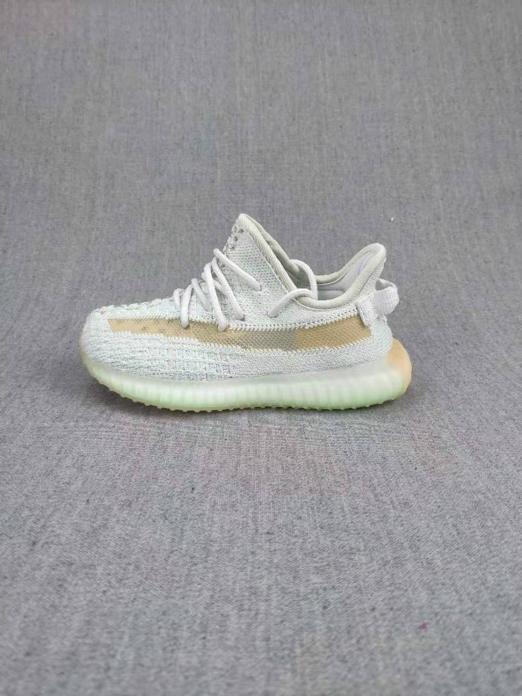 Yeezy Boost 350 V2 Kids Sneakers, in Light Neutral - product image from the listing.