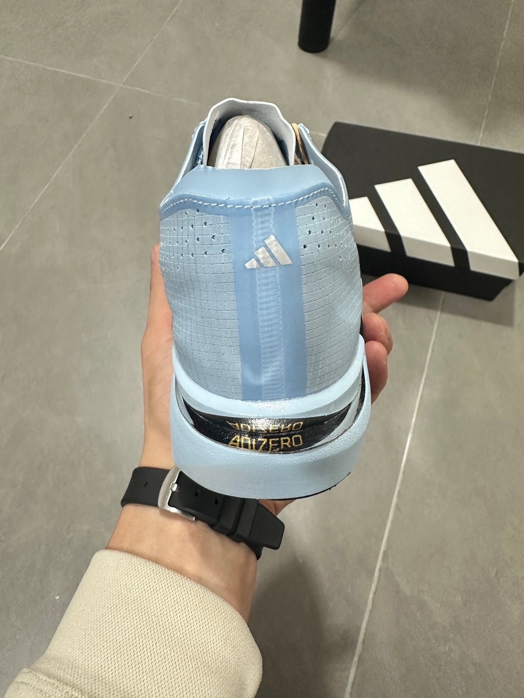 adidas Adizero Adios Pro Running Shoes, in Light Blue and Black - product image from the listing.