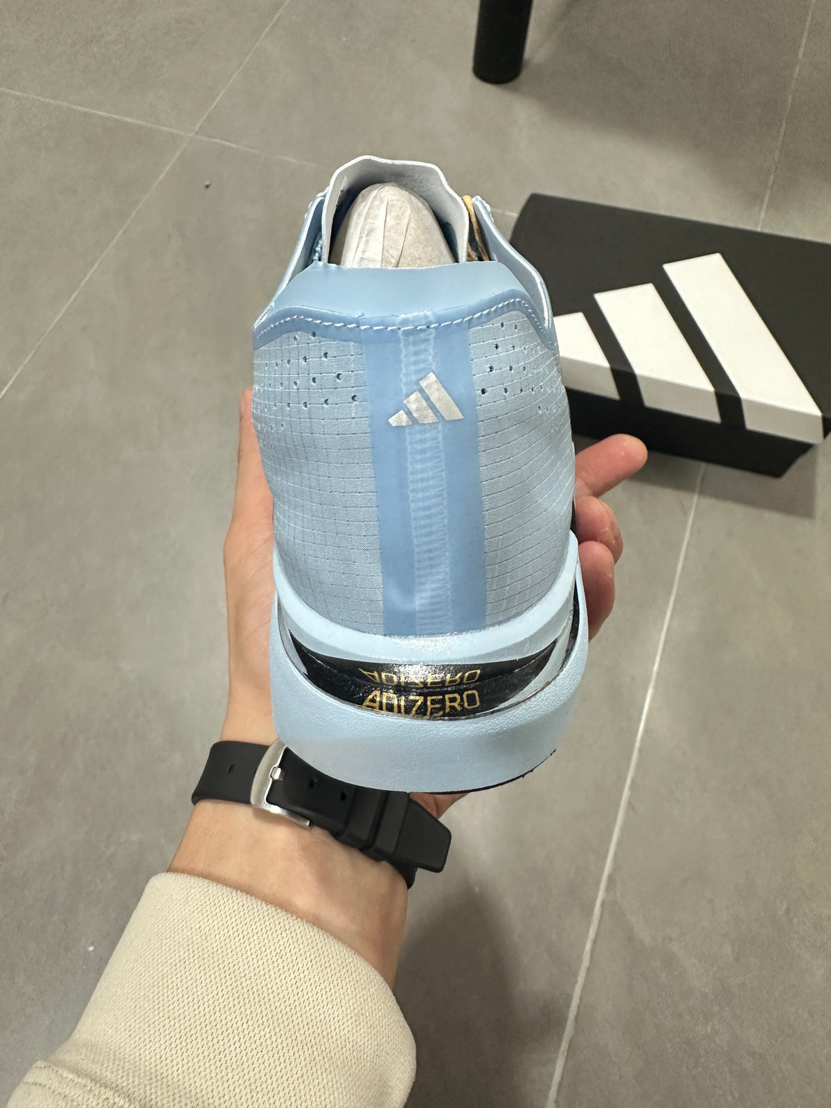 adidas Adizero Adios Pro Running Shoes, in Light Blue and Black - product image from the listing.
