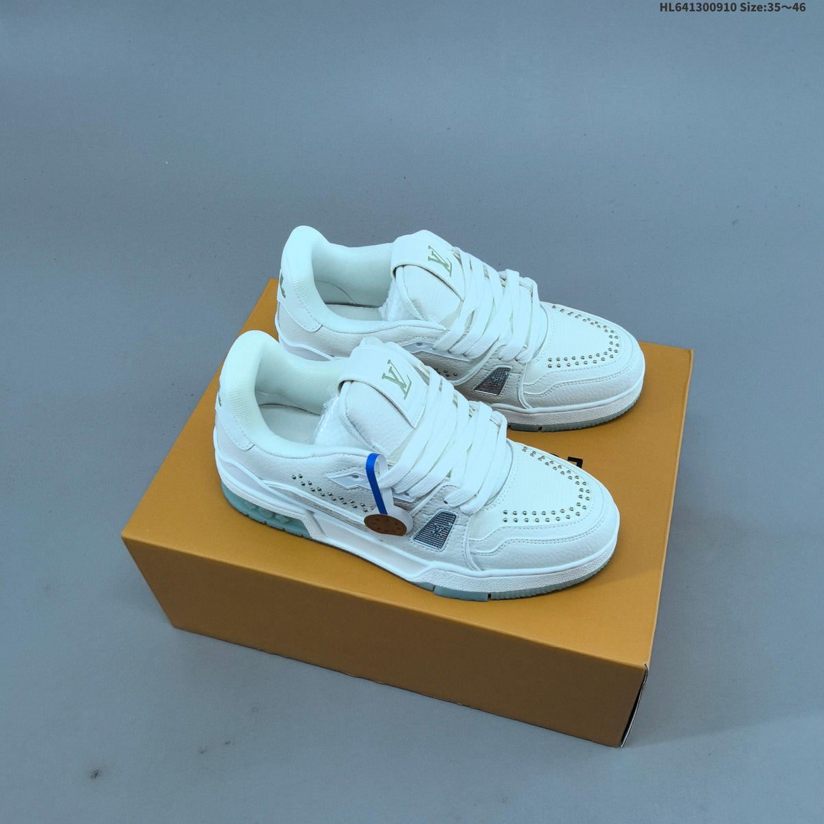 White and Black Louis Vuitton Studded Low-Top Sneakers - product image from the listing.