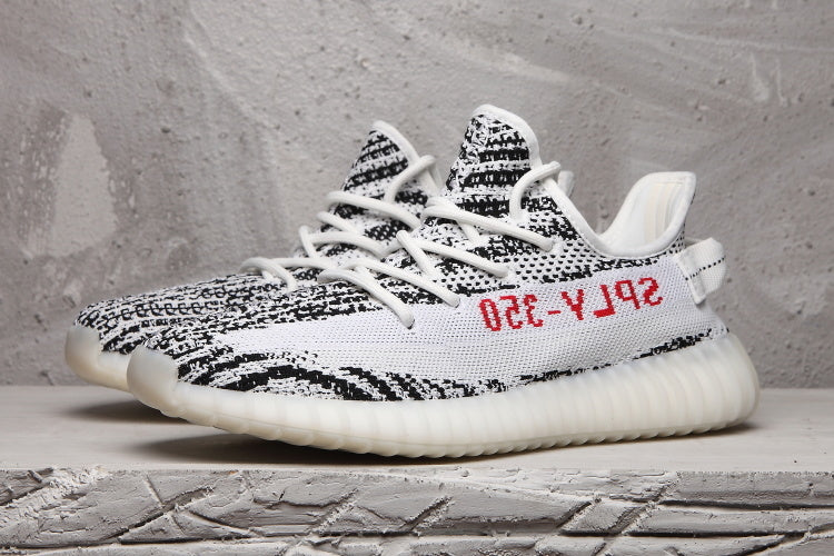 Yeezy 350 V2 Sneakers in Black and White Knit - product image from the listing.
