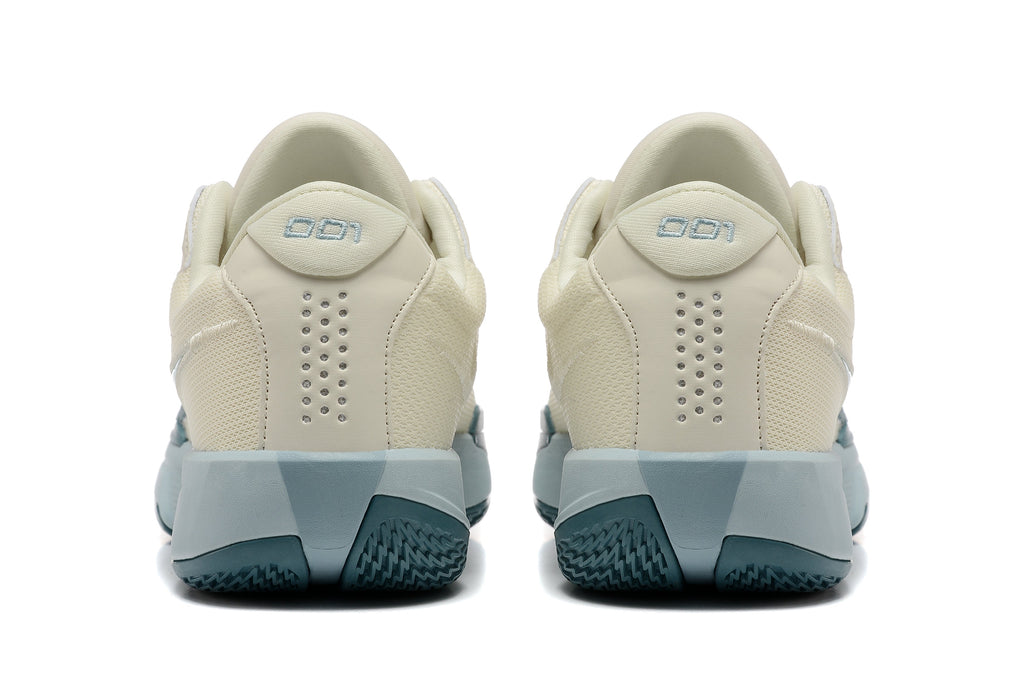 Nike G.T. Cut Academy Basketball Shoes, in Sail and Blue - product image from the listing.