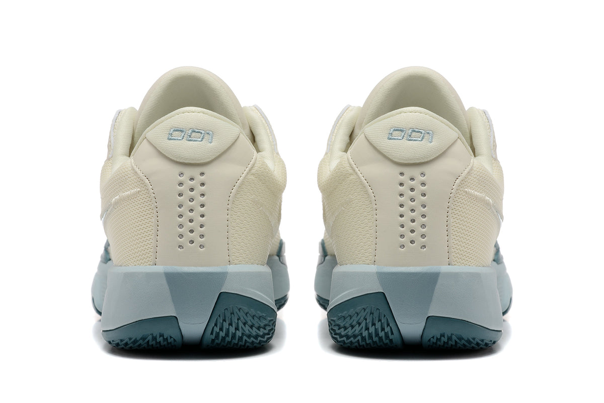Nike G.T. Cut Academy Basketball Shoes, in Sail and Blue - product image from the listing.