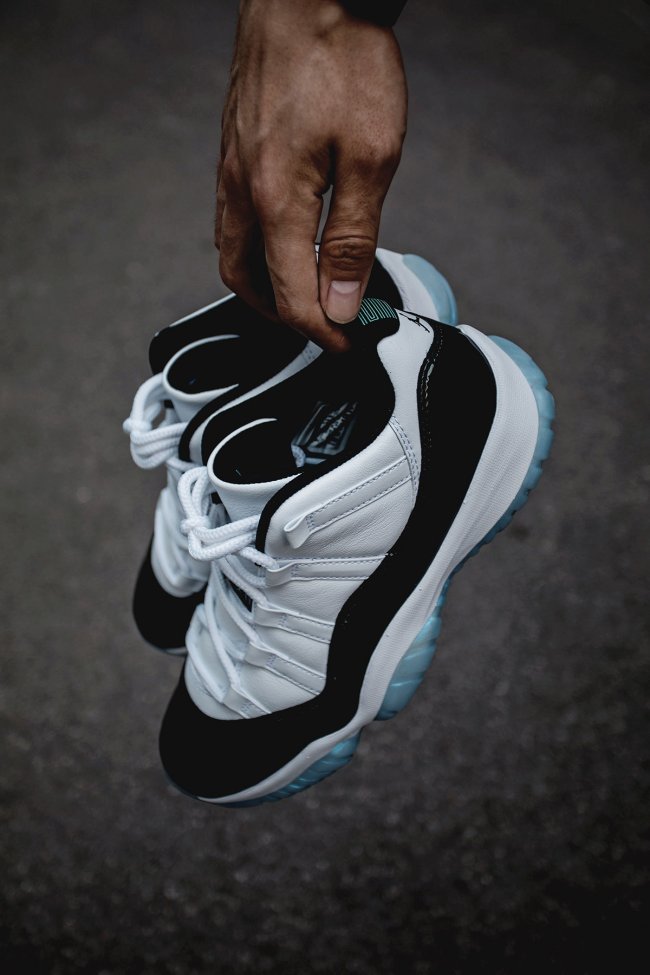 White and Black Air Jordan 11 Iridescent Sneakers - product image from the listing.